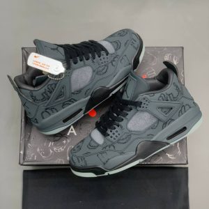 Air Jordan 4 Retro x Kaws black suede luminous